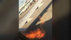 Utair Boeing 737 engine spouts FLAMES on runway just before takeoff (VIDEO)