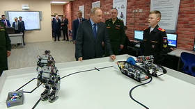 Ready, steady, go! Sporty robots perform push-ups for Putin (VIDEO)