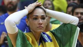 Brazilian volleyball star faints midway through live court-side interview (VIDEO)