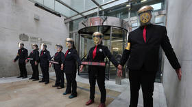 Sticking it to the man: Climate change protesters glue themselves to London Stock Exchange (VIDEO)