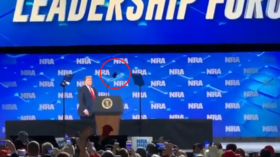 WATCH: Did someone just throw a PHONE at Trump during his NRA speech? 