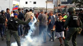 WATCH tear gas fired on highway near Caracas air base where Guaido appeared in video with soldiers 