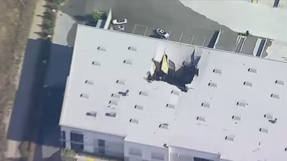 Armed F-16 jet crashes into warehouse as pilot ejects at California ...