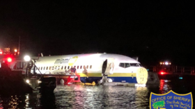 Boeing 737 skids off runway into Florida river (PHOTOS)