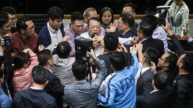Fists fly in Hong Kong parliament as debate over extradition law boils over