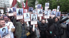 Ukrainian nationalists mock Immortal Regiment march with portraits of Avengers (VIDEO)
