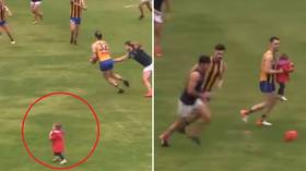 'That looks consensual': Aussie rules players warned over light-hearted bum-grab during game