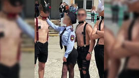 Cop uniforms and nipple tape: BDSM-themed high school graduation stunt shocks Russian city