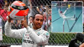 Making a splash: Lewis Hamilton celebrates Monaco GP win by jumping into swimming pool (VIDEO)