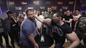 Clash of the titans! Russian slap champ 'The Dumpling' takes on foot-long bicep guy 'Bazooka Arms' 