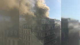 Smoke pours from London building as dozens of firefighters battle blaze (VIDEO)