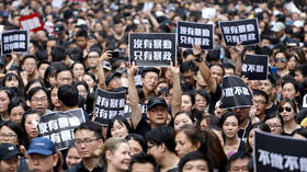 Hong Kong leader apologizes to nation as massive protests over extradition bill grip city