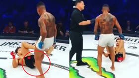 'Giving him an oil check': Bizarre scenes as MMA fighter sticks toe up opponent's backside (VIDEO)
