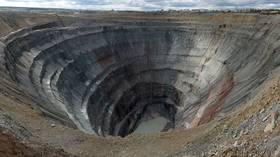 Venture into Earth’s depths with AERIAL FOOTAGE of massive Siberian diamond mine