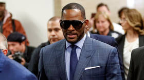 Prosecutors unveil multiple indictments charging singer R Kelly over alleged sex crimes