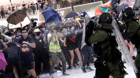 Umbrellas v. batons: Protesters clash with police at Hong Kong mall (VIDEO)