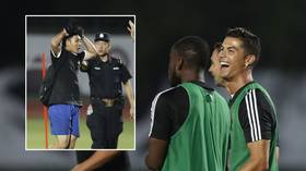 WATCH: Cristiano Ronaldo jumps on Chinese police officer as fan invades Juve training