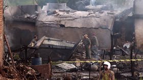 Pakistani military plane crashes in residential area, killing 17 as fire engulfs crash site