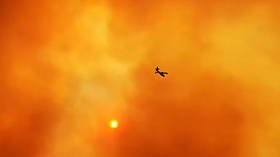 WATCH plane enter ‘hellish’ BRIGHT ORANGE skies as it battles massive wildfires on Greek island