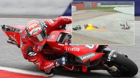 Rider hospitalized as bike erupts in flames in British MotoGP horror smash (VIDEO)