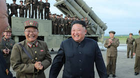 He does love missiles! Smiling Kim tests N. Korea’s ‘super-large multiple rocket launcher’ (PHOTOS)