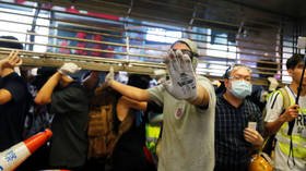 Man beaten unconscious at Hong Kong protests (VIDEO)