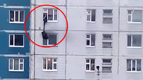 WATCH: Stranger rescues girl from BURNING apartment by pulling her through window on floor above