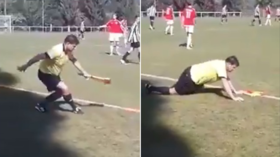 They see me rolling: Drunk Czech linesman sways & sprawls near pitch while officiating youth football game (VIDEO)