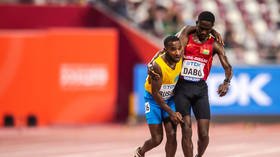 WATCH: Heartwarming scenes as runner helps stricken rival stagger across the line at World Athletics Championships in Doha