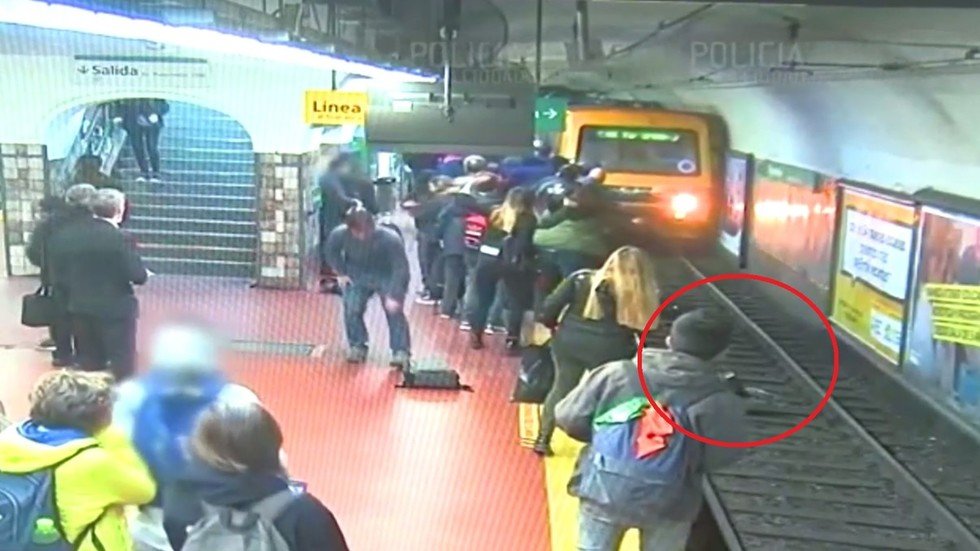 WATCH: Buenos Aires commuters stage frantic rescue after woman KNOCKED ...