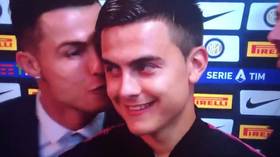 Kiss-tiano: Cristiano Ronaldo gives Juventus teammate Paulo Dybala a peck on the cheek during post-match interview (VIDEO)