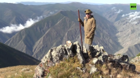 WATCH Putin hiking & driving off-road in Siberian mountains in signature holiday VIDEO