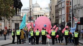 ‘Get the cuffs on him… you’ll need four pairs’: Police march giant Extinction Rebellion OCTOPUS to Trafalgar Square (VIDEO)