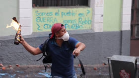 'Absolute chaos' as thousands protest in Ecuador's capital, braving tear gas and clashes with police