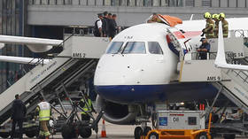 Paralympic athlete climbs ON TOP of British Airways jet in Extinction Rebellion protest (PHOTOS, VIDEO)