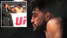 Lean on me: Kelvin Gastelum makes weight for UFC 244, but appears to LEAN on coach to hit his mark (VIDEO)