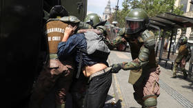 Chilean riot police knock down & drag elderly protester in brutal arrest amid massive anti-neoliberal protests (VIDEOS)