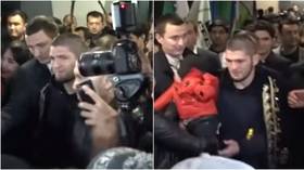 Trumpets, babies & cavalcades: Watch Khabib get mobbed as he arrives in Uzbekistan ahead of cousin’s fight