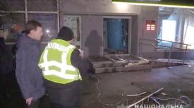 Cash flies, windows shatter: Hapless bank robbers try to blow ATM up in Kiev... but overdo it on explosives (PHOTOS)