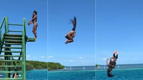 Making a splash: Gymnastics legend Simone Biles pulls off jaw-dropping dismount into the sea (VIDEO)
