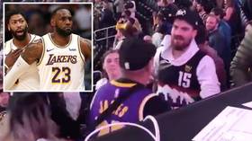 Granite chin: Denver Nuggets fan shrugs off HUGE punch during crowd fight after LA Lakers game