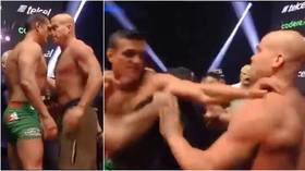 'Staged!': Fight fans react as MMA veteran Tito Ortiz gets into shoving match with pro wrestler Alberto 'El Patron' (VIDEO)