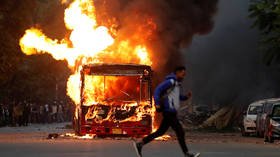 Protesters TORCH buses and clash with police in Delhi as Indian citizenship bill sparks street violence (PHOTOS, VIDEOS)