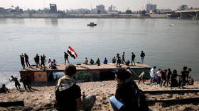 Iraqi MPs approve new election law, a key demand of protesters