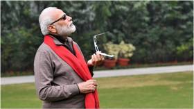Indian PM Modi says memes 'most welcome' after tweeting pic of himself observing solar eclipse (PHOTOS)