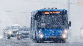 CHILLING VIDEO captures snow-covered passengers traveling on Russian bus with broken vent window