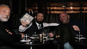 Conor cashes in: McGregor laughs as UFC boss Dana White hands him $50K IN CASH over whiskies to celebrate Cerrone win