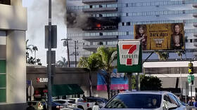 WATCH: Man escapes high-rise LA apartment inferno by climbing onto window ledge