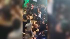 Chairs & bottles fly as Moscow MMA event turns into mass brawl (VIDEO)