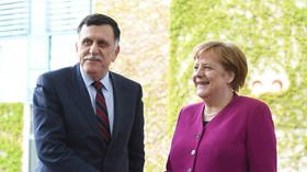 Merkel urges UN-backed Libyan PM Sarraj to sign ceasefire